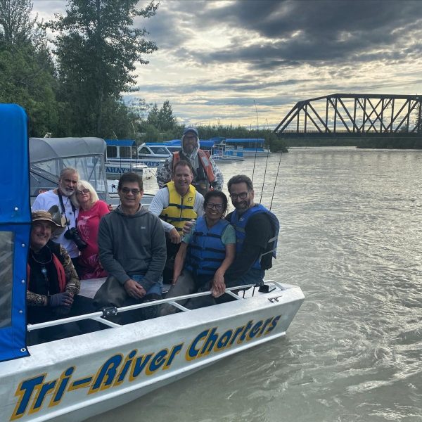 a group of people on a boat in the water