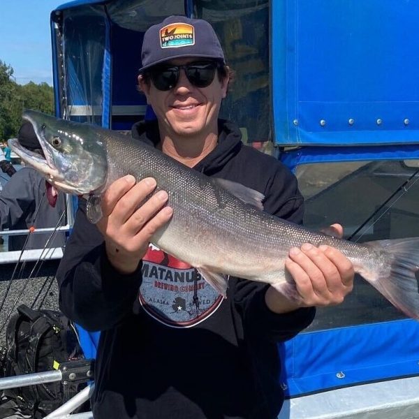 a man holding a fish