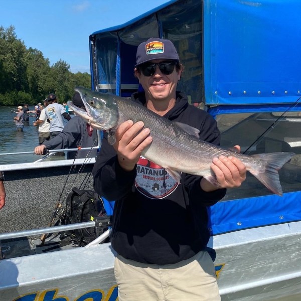 a man holding a fish