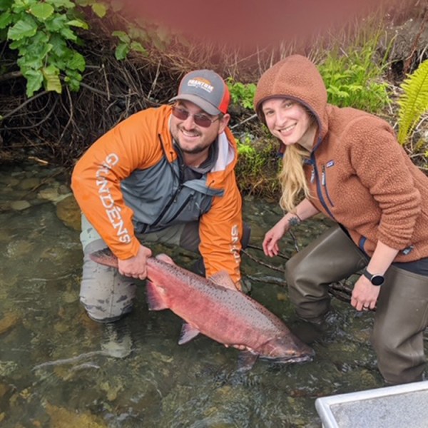 a person holding a fish