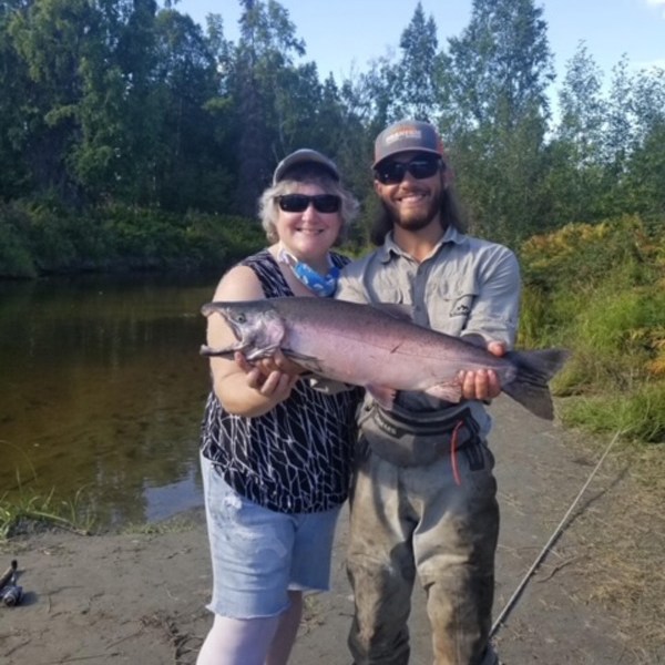 a man holding a fish