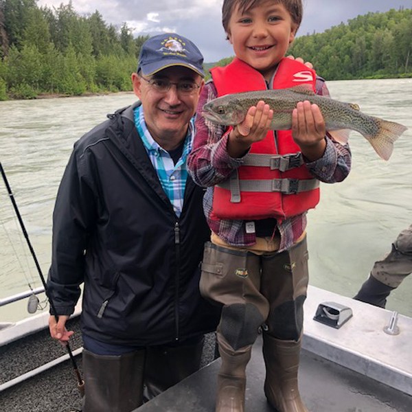 a man holding a fish