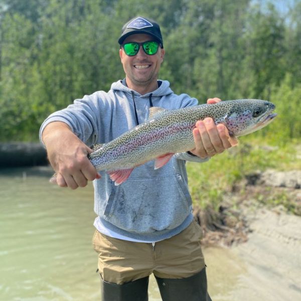 a man holding a fish