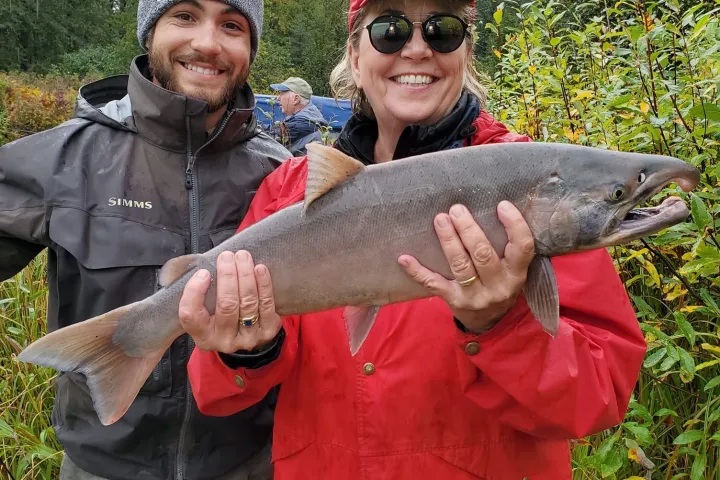 a man holding a fish