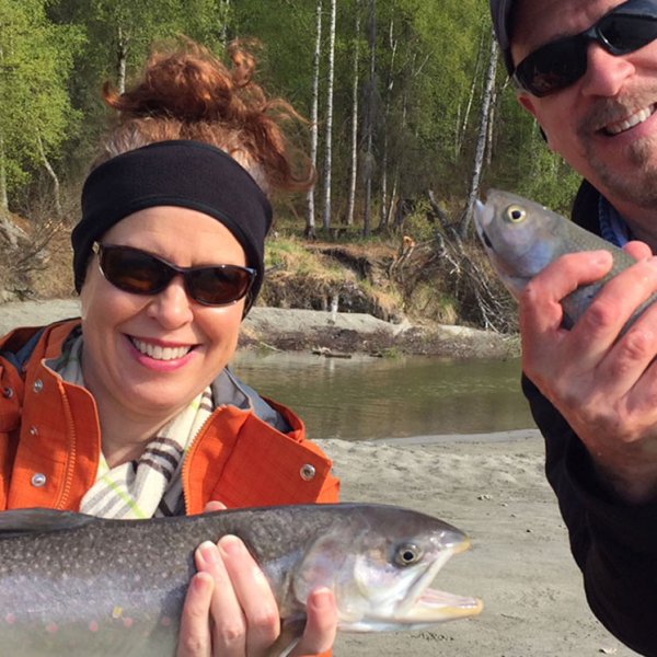a man holding a fish