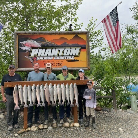 a group of people standing around a bench