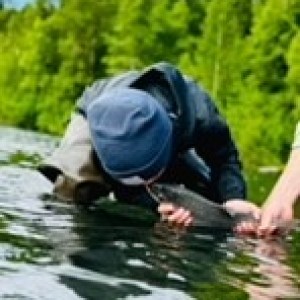 a person riding a surf board on a body of water