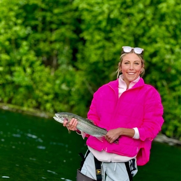 a person riding on the back of a boat
