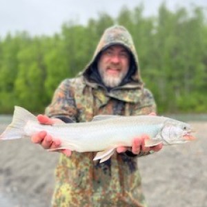 a man holding a fish