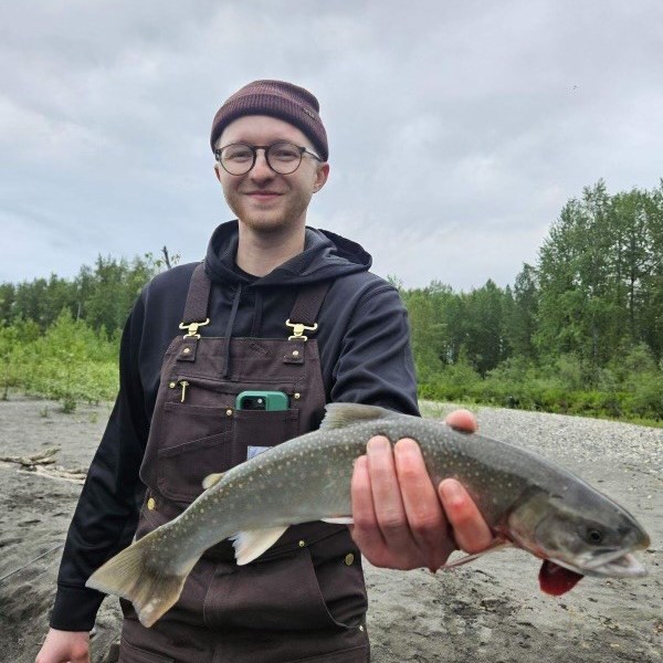 a man holding a fish